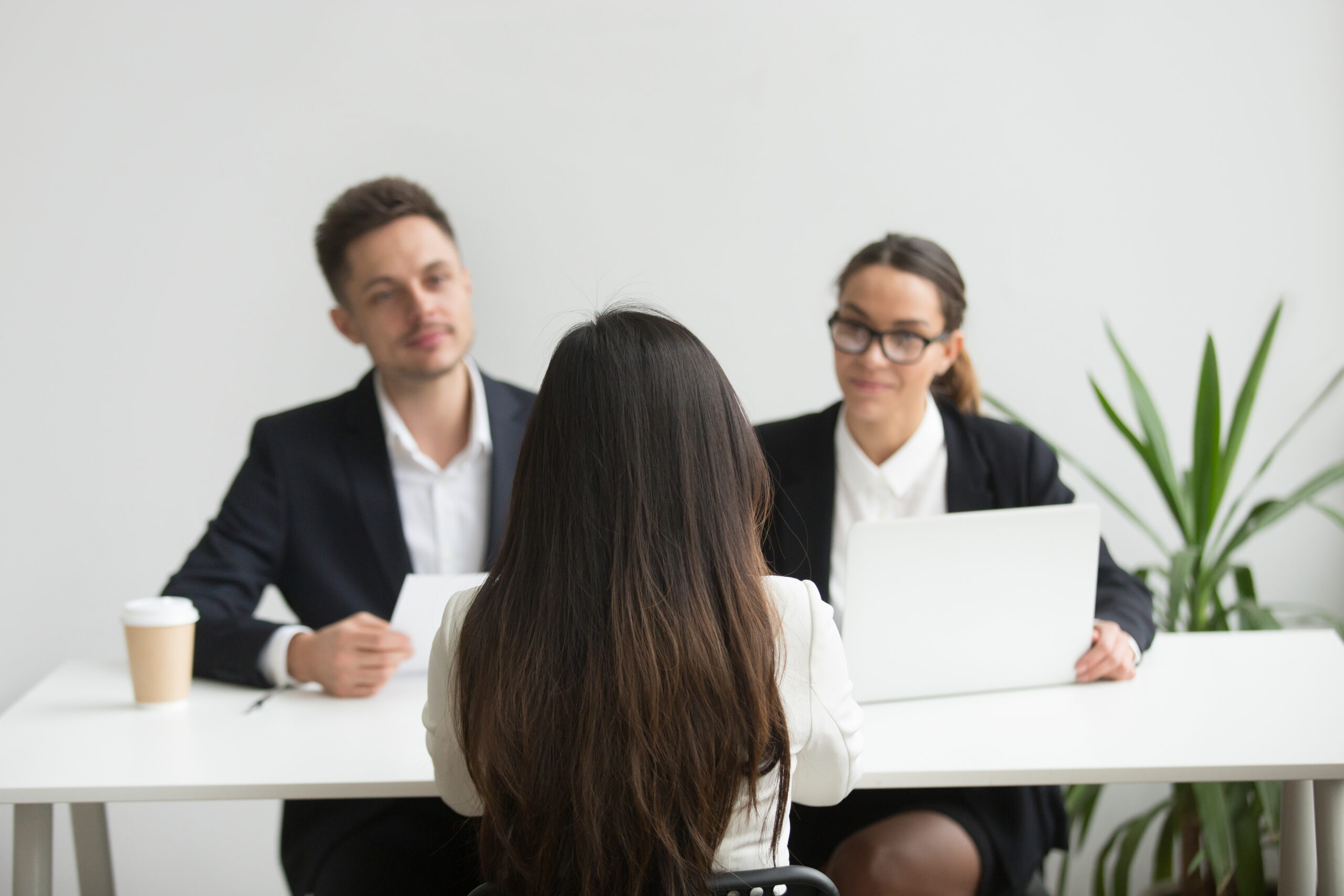 headhunters interviewing female job candidate scaled